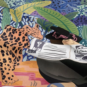 Detail of bohemian jungle tapestry showing a leopard and person reading newspaper