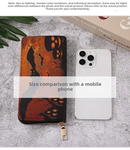 Halloween wallet size comparison with iPhone showing spooky skull and bat print detail