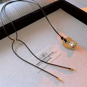 Minimalist gold irregular heart pendant on black cord necklace for luxury fashion
