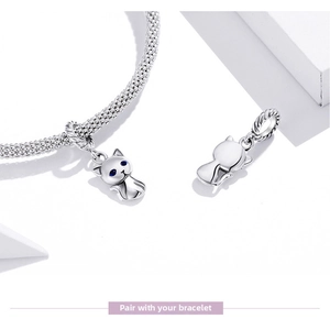 Detail of s925 silver cat charm with blue zircon eyes on a snake chain bracelet