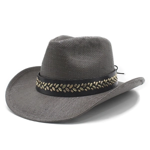 Dark grey straw cowboy hat with wide brim and leather band with gold metal studs