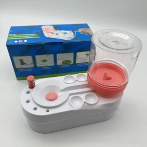 Macro detail of automatic paintbrush cleaner with 250ml water tank and pink drain button