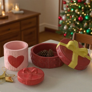 Detailed view of heart-patterned resin mold containers with knitted texture and bow lid