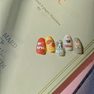 Detail of 3D embossed nail art stickers featuring cute bulldog and strawberry cake designs