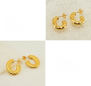Detail of 18K gold-plated U-shaped earrings with unique hammered texture and polished finish