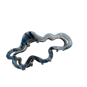 Elegant blue marble acetate cloud hair claw clip with metal spring on white background