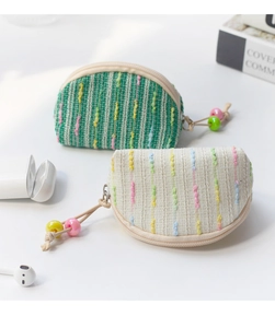 Detail of colorful striped mini canvas pouches with zipper and bead pullers
