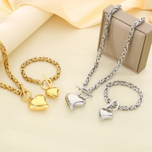 Gold and silver Byzantine chain jewelry set with heart pendant and OT toggle clasp