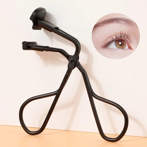 Close-up of black eyelash curler with silicone pad and result demonstration view