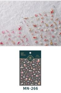 Macro detail of MN-266 3D embossed nail stickers with peach blossoms and traditional motifs