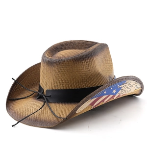 Close-up of woven straw cowboy hat with American flag eagle print and leather band