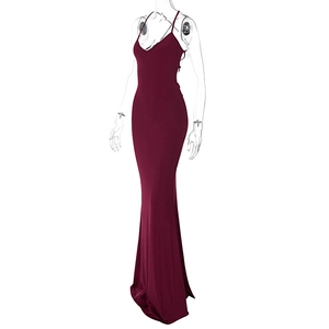 Detail of burgundy backless halter dress with elegant ruching and slim fit design