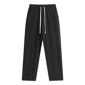 Minimalist black wide-leg joggers with drawstring waist and central vertical seams