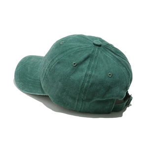 Detail view of the washed cotton baseball cap featuring the adjustable metal buckle strap