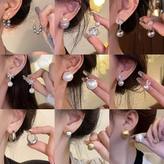 Collection of pearl drop earrings and gold zircon studs in elegant 9-square grid display