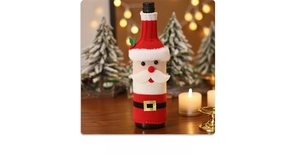 Detailed knit texture of Santa wine bottle cover with plush beard and belt detail