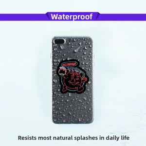 Waterproof neon graffiti sticker showing red cartoon character on smartphone back