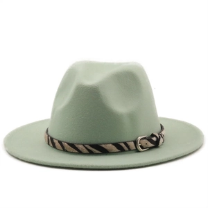 Detail of mint green wool fedora hat with zebra pattern band and silver metallic buckle