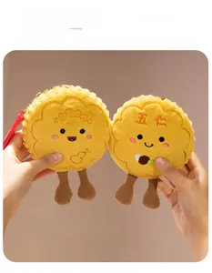 Detailed view of plush mooncake charms with cute embroidery and hanging ropes