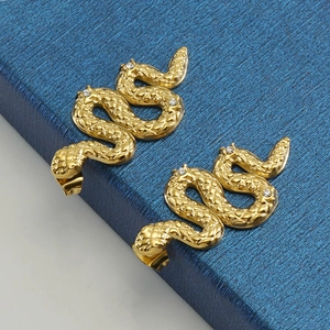 18K gold plated stainless steel snake earrings featuring white zircon scales on jewelry box