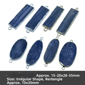Macro detail of natural blue kyanite pendants with gold and silver plated edges