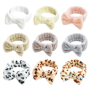 Plush bow headband set in various solid colors and leopard prints for women