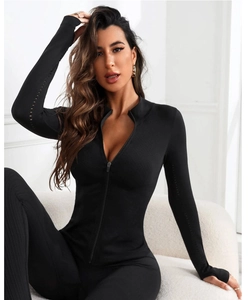 Close-up of black yoga jacket with hollow-out sleeve design and thumbhole cuffs