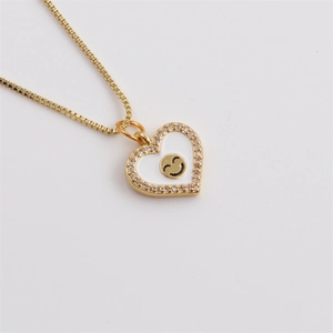 Golden heart necklace with white enamel inlay, micro-paved zircon and smiley face charm