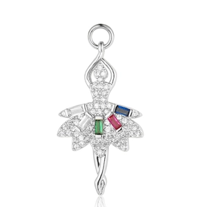 Detailed macro shot of a ballerina pendant inlaid with colorful zirconia and crystals