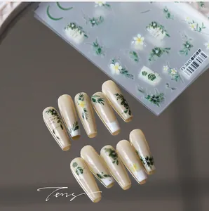Detailed close-up of TS-3655 nail stickers with green leaf and floral embossed patterns