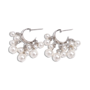 Silver geometric C-shaped hoop earrings with cascading faux pearl tassels on white background