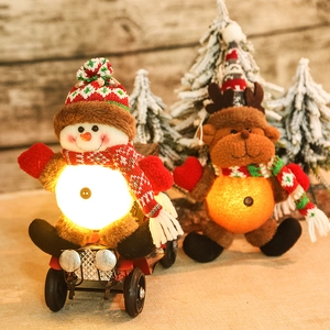 Lighted Christmas snowman and reindeer figurines with red vintage car holiday decor