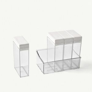 Minimalist transparent 4-grid seasoning box set with white lids and a storage base