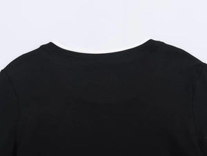 Detail of the crew neck collar with contrast white inner lining and precision stitching