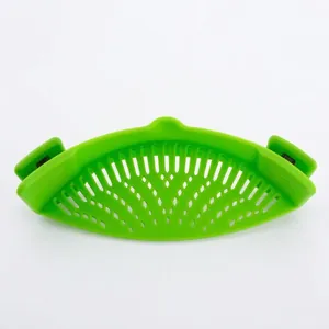 Green silicone clip-on pot strainer for draining pasta and vegetables with secure clamps