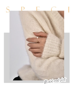 Elegant gold-tone adjustable open ring with white pearl and metal ball on model's finger