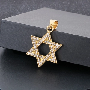 Detail of gold star of David pendant with shimmering cubic zirconia on black box