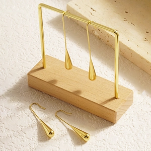 Chic golden waterdrop dangle earrings with sleek titanium steel hooks in a modern design