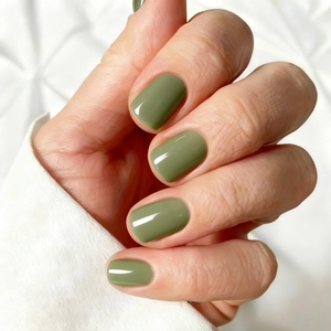 Glossy olive green press-on nails in a short square shape with smooth mirror finish