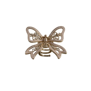 Elegant gold butterfly hair claw clip with pearls in a symmetrical top-down view