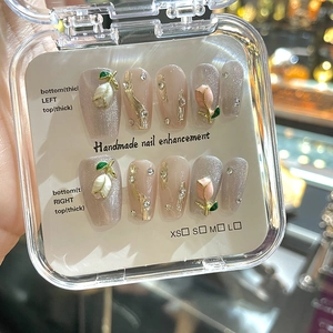 Handmade press-on nails featuring 3D tulip patterns with glitter and rhinestones