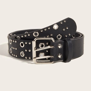 Detail of black punk leather belt with silver double grommets and metal rivets