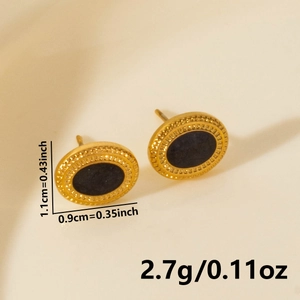 Macro detail of gold round stud earrings with black center and precise measurements
