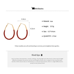 Detail showing dimensions of large red oval drop earrings with silver needle posts