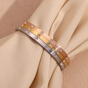 Three-piece stainless steel bangle set in gold, rose gold and silver with cubic zirconia