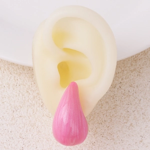 Pink teardrop drip oil earring displayed on a silicone model for a realistic jewelry fit