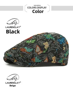 Detail of colorful butterfly embroidery on black fabric vintage duckbill cap