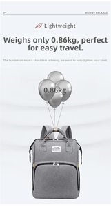 Detail view of lightweight grey 0.86kg multi-functional diaper bag with fabric label