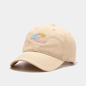 Detailed view of beige cotton baseball cap with colorful planet embroidery and curved brim