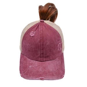 Detail of burgundy washed cotton baseball cap with mesh back and ponytail criss-cross hole